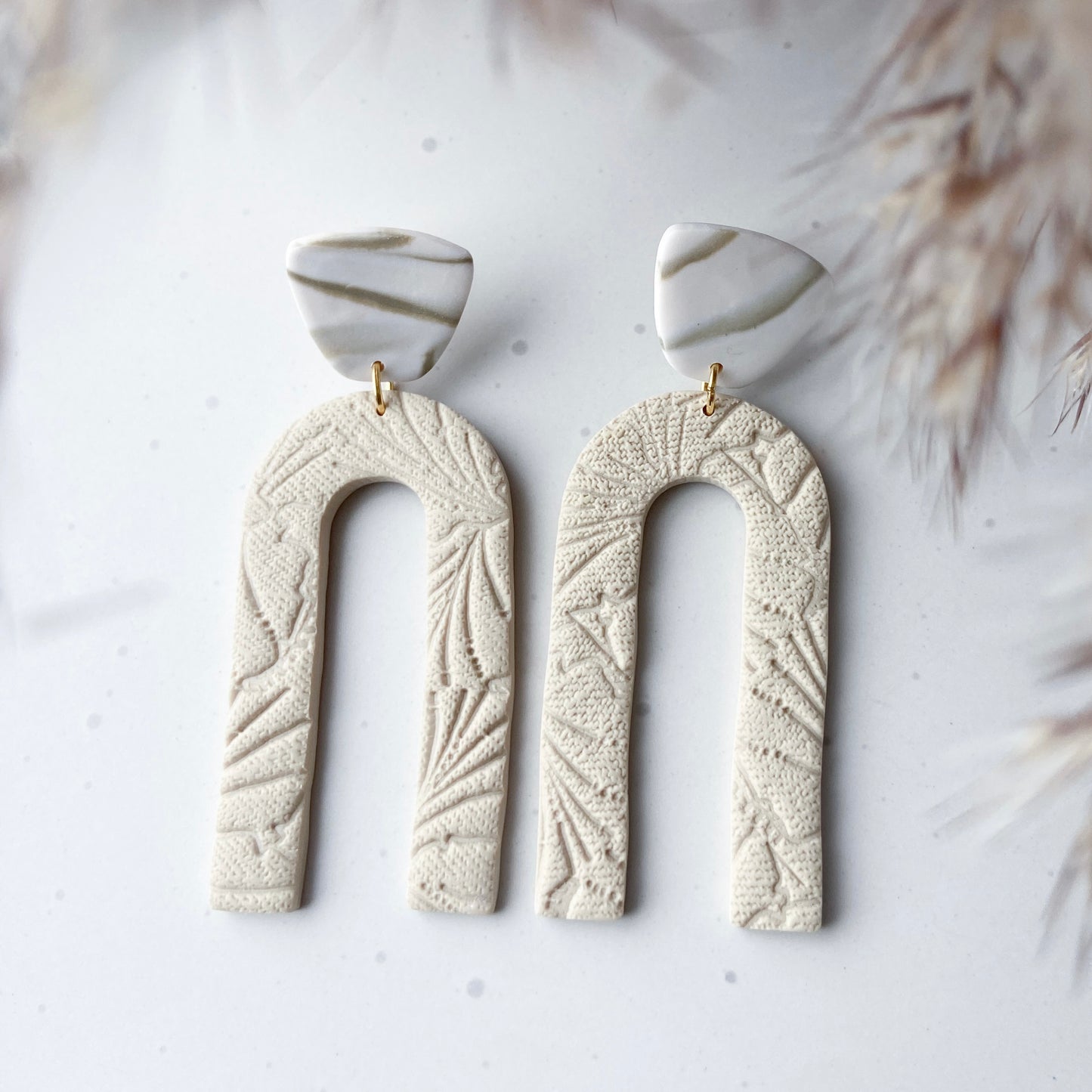 Long arch statement earrings